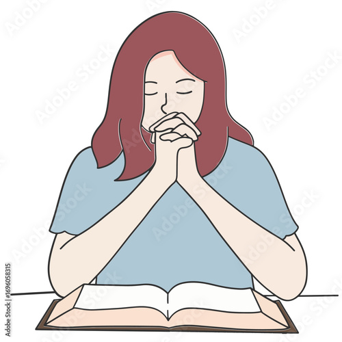 Woman praying on bible