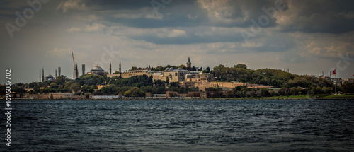 Topkapi Palace is clearly in the foreground. In the background, you can see Hagia Sophia, the minarets of the Sultanahmet Mosque (Blue Mosque), and other historical buildings.