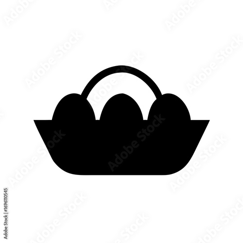 Image of a basket containing three oval objects or eggs