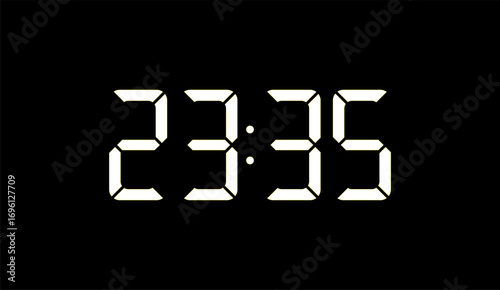 Digital clock displaying the time 23:35 in white against a black background, showing hours and minutes.