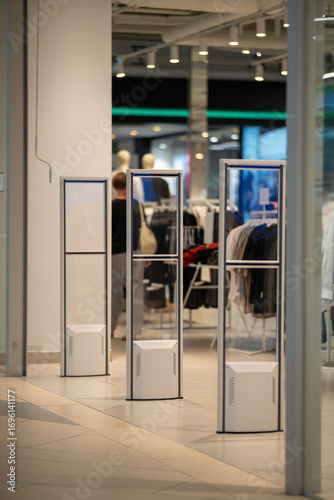 Radio-frequency security gates with integrated metal detector at a clothing store entrance