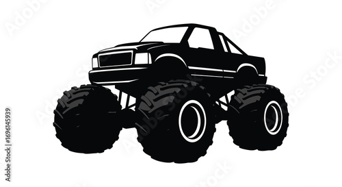 a large black monster truck with massive wheels