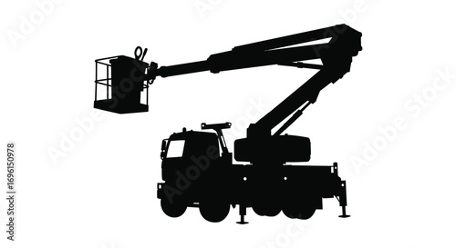 a silhouette of a truck with an extended crane arm