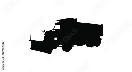 a silhouette of a snowplow truck in action