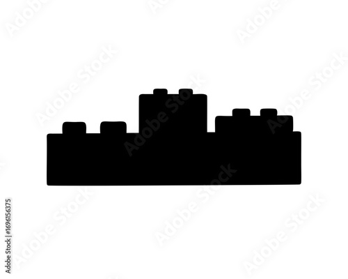 Silhouette of a plastic toy building block on a white background