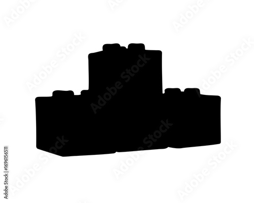 Silhouette of interlocking plastic building blocks stacked to form simple construction