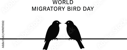 Two black birds are perched on a wire, celebrating world migratory bird day