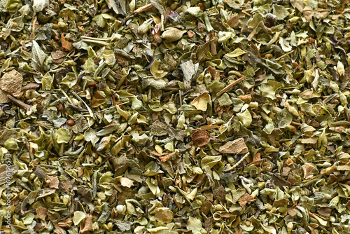 Mixed dried herbs seasonings texture background.