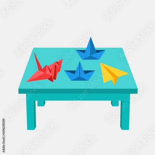Origami paper boats and planes on a small blue table against a white background.