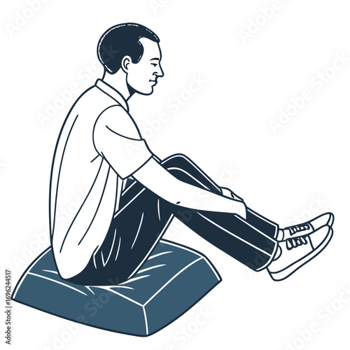 Man sitting on a yoga cushion, isolated white background.