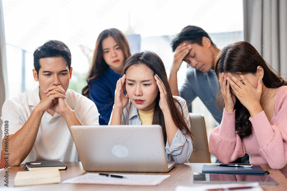 Fototapeta premium Tired business team are having a briefing meeting, can't find solution. Exhausted male and female employees fail a startup, upset about work troubles, unsuccess and overwork concept.