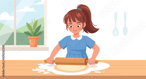 A happy young girl with a ponytail rolling out dough on a wooden table.
