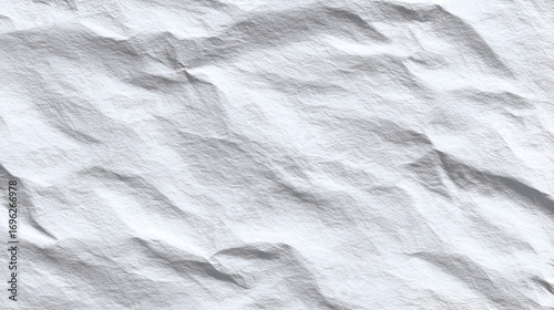 White crumpled paper with textured surface  varied shadows