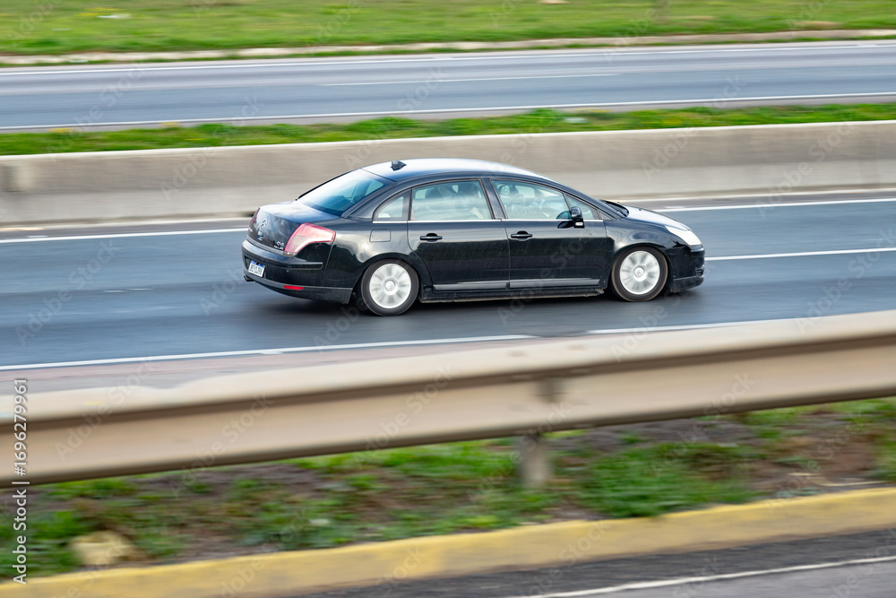 Fototapeta premium Driven by Precision: Sleek Motion on the Expressway