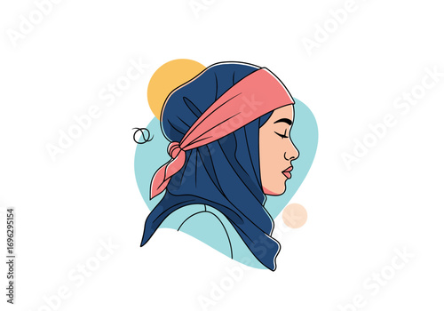 Portrait of a young muslim woman wearing a blue hijab and a pink headscarf with her eyes closed peacefully