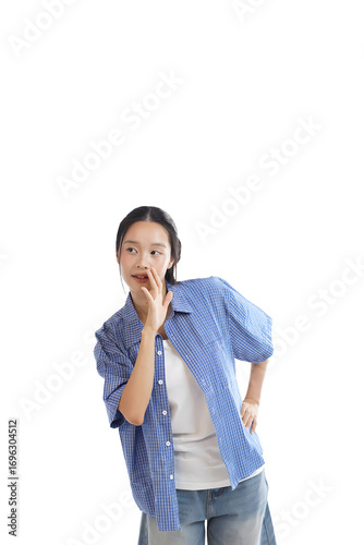 Photography Whisper of a Secret: A young woman stands confidently, hand raised to her lips as if sharing a clandestine whisper
