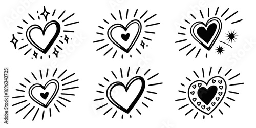 Hand Drawn Hearts with Sparkles and Rays.