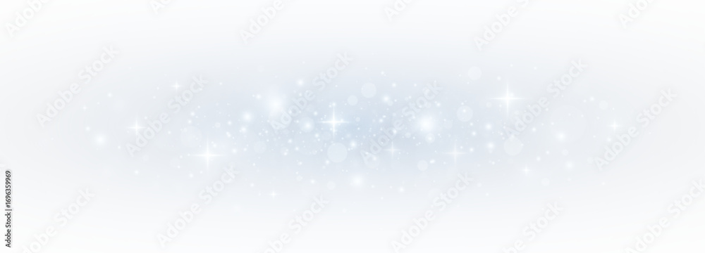 Glistering blue bokeh with sparkling stardust and festive confetti. Magical light and glittering particles forming a vibrant Christmas card effect.