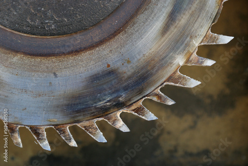Rusty circular  saw blade teeth close up view.
