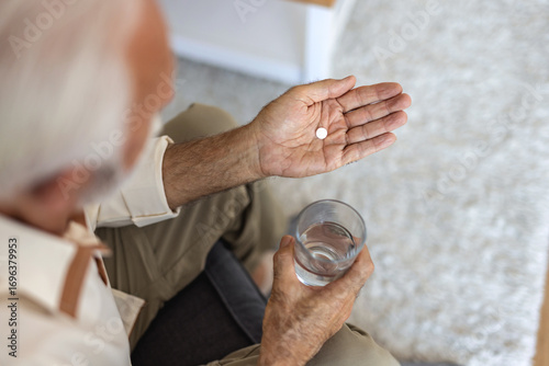 Home medicine, hands or senior person with pills tablet, medication and pharmaceutical prescription for healthcare support. Closeup and sick patient with medical supplements, drugs or antibiotics.