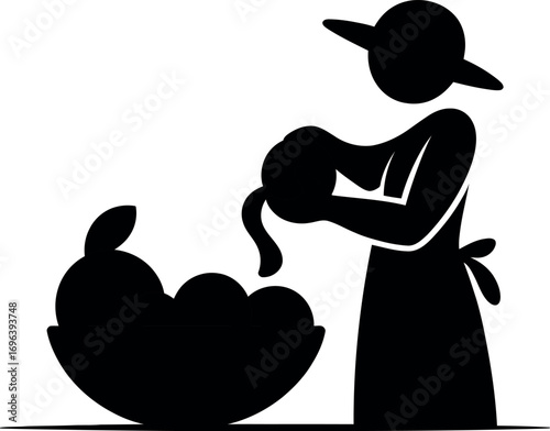 Silhouette of a hand peeling a piece of fruit