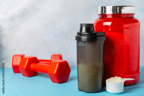 Protein powder. protein shake. Shaker bottle with protein. Food supplement. Whey protein powder with shaker for mixing. Sports nutrition. Concept of sports and healthy lifestyle. Sports equipment