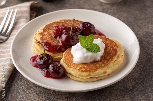 Wallpaper Mural Freshly made cheesecakes served with cherry jam, creamy sour cream, and mint on a dish for breakfast. Torontodigital.ca