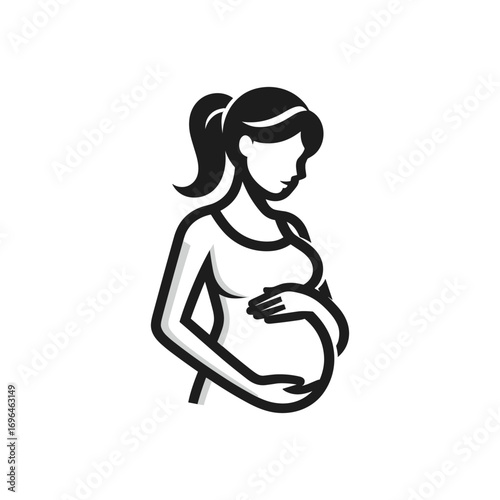 Pregnant woman gently cradling her belly in peace