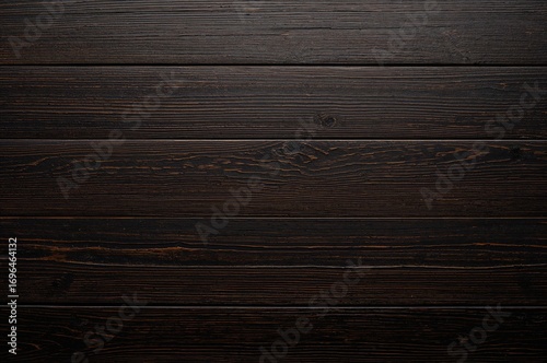 Flat lay of a dark wood pla...