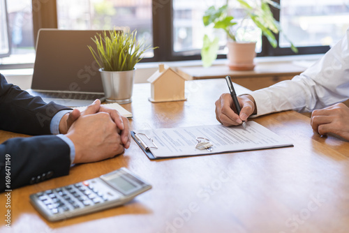 Asian tenant, client man sign signature contract rental purchase, buyer home or apartment with landlord, realtor after banker agreement mortgage, loan success or done. Property lease agent concept.