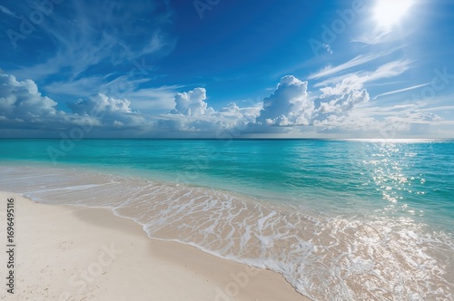 Fototapeta Naklejka Na Ścianę i Meble -  Breathtaking summer scenery where pristine white sands touch the transparent azure ocean, under a sky adorned with soft clouds and sunlight shimmering over calm waters.