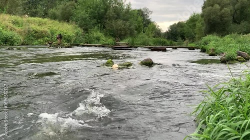 Fast current on the river with sound.