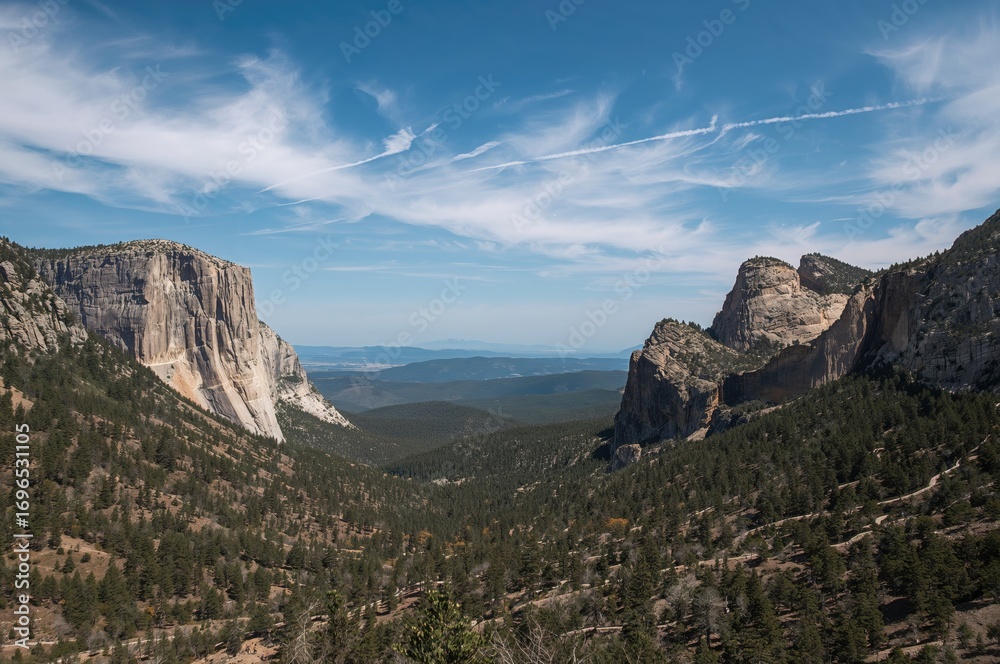 Naklejka premium Scenic lookout with winding trails and lush greenery under a summer sky