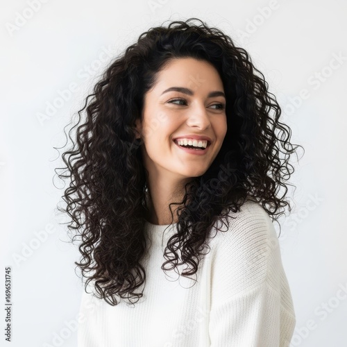 Smiling woman with long curly dark hair