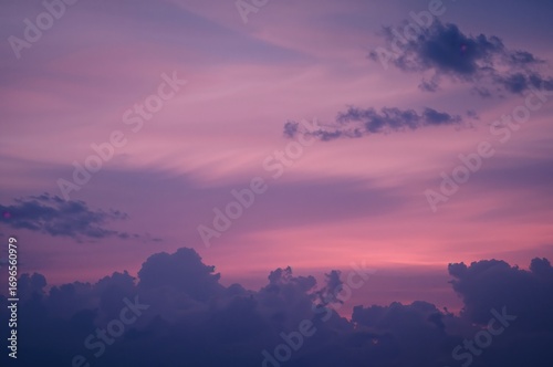Wide Sunset Horizon Displaying a Spectrum from Blue to Purple with Soft Evening Clouds and a Gentle Pink Radiance