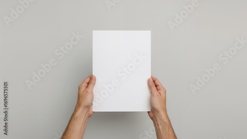 White blank paper held by hands