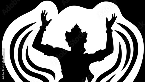silhouette of a traditional wayang epic character with raised hands and abstract wing-like background