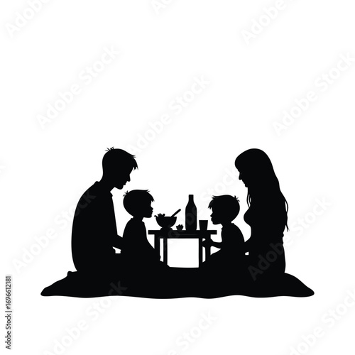 Family picnic silhouette with food and drinks on a blanket