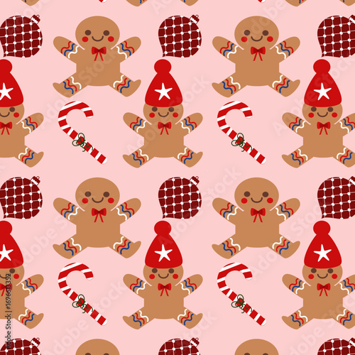 Pattern natalizio con gingerbread, palline, bastoncini di zucchero su sfondo rosa