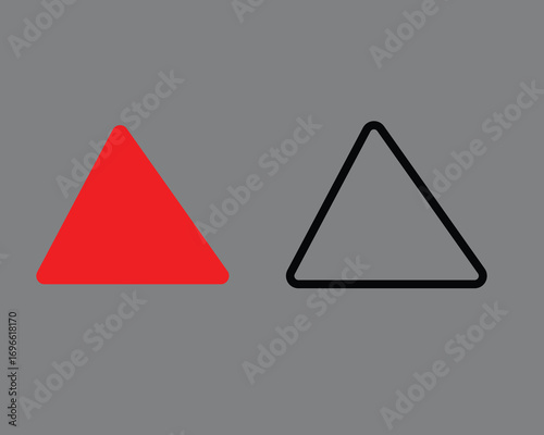 Red triangle shape beside black outline triangle shape on gray background vector