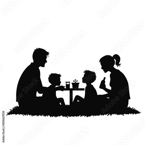 Family picnic silhouette with two children and parents