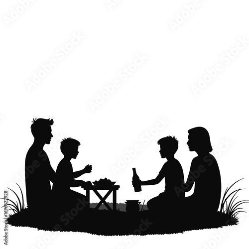 Family Silhouette Having Picnic Outdoors With Grass