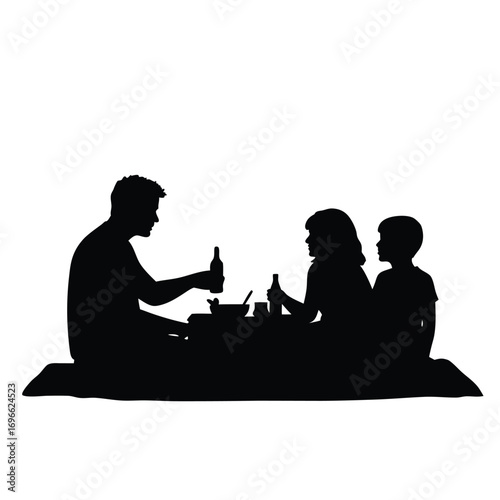 Father and two children silhouette at a picnic outdoor