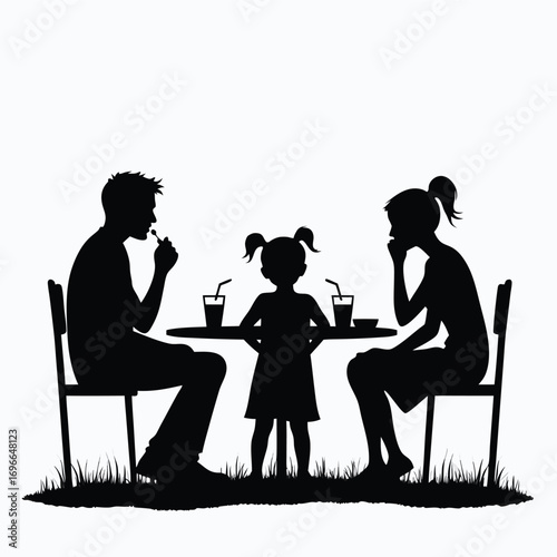 Family silhouette eating at outdoor cafe table with drinks