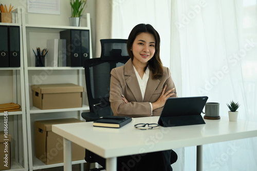 Photography Corporate woman in office attire looking confident and approachable, suitable fo