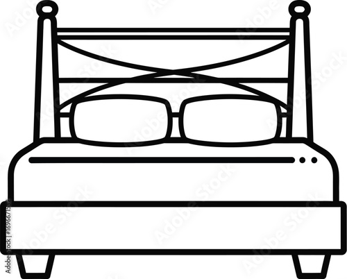 Cozy bed with reading glasses, inviting rest and relaxation.