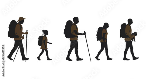 hikers walking in line with backpacks and trekking poles silhouette