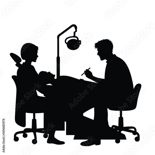 Dentist and assistant silhouette examining patient in dental chair