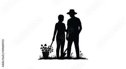 father and child standing together holding flowers silhouette