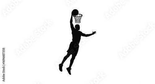basketball player dunking ball action shot in silhouette